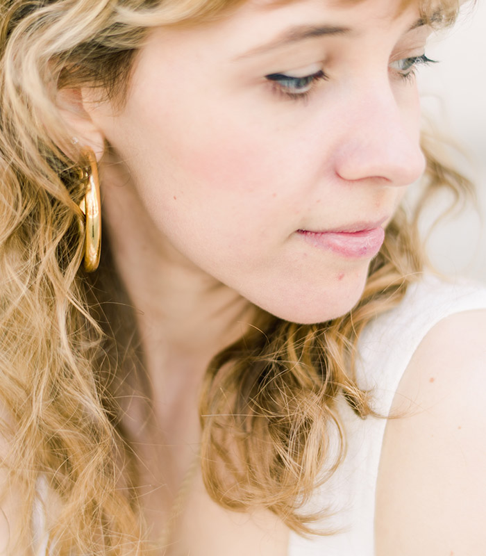 A woman is overwhelmed by anxiety in a busy, public center